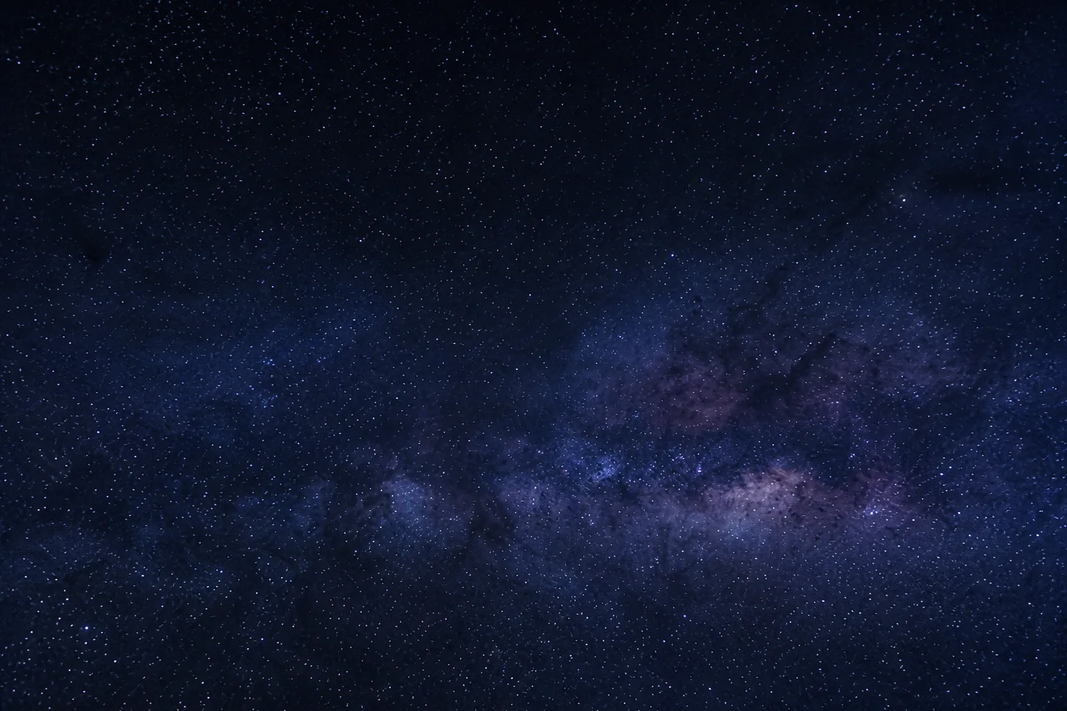 A field of stars over a dark beach evening