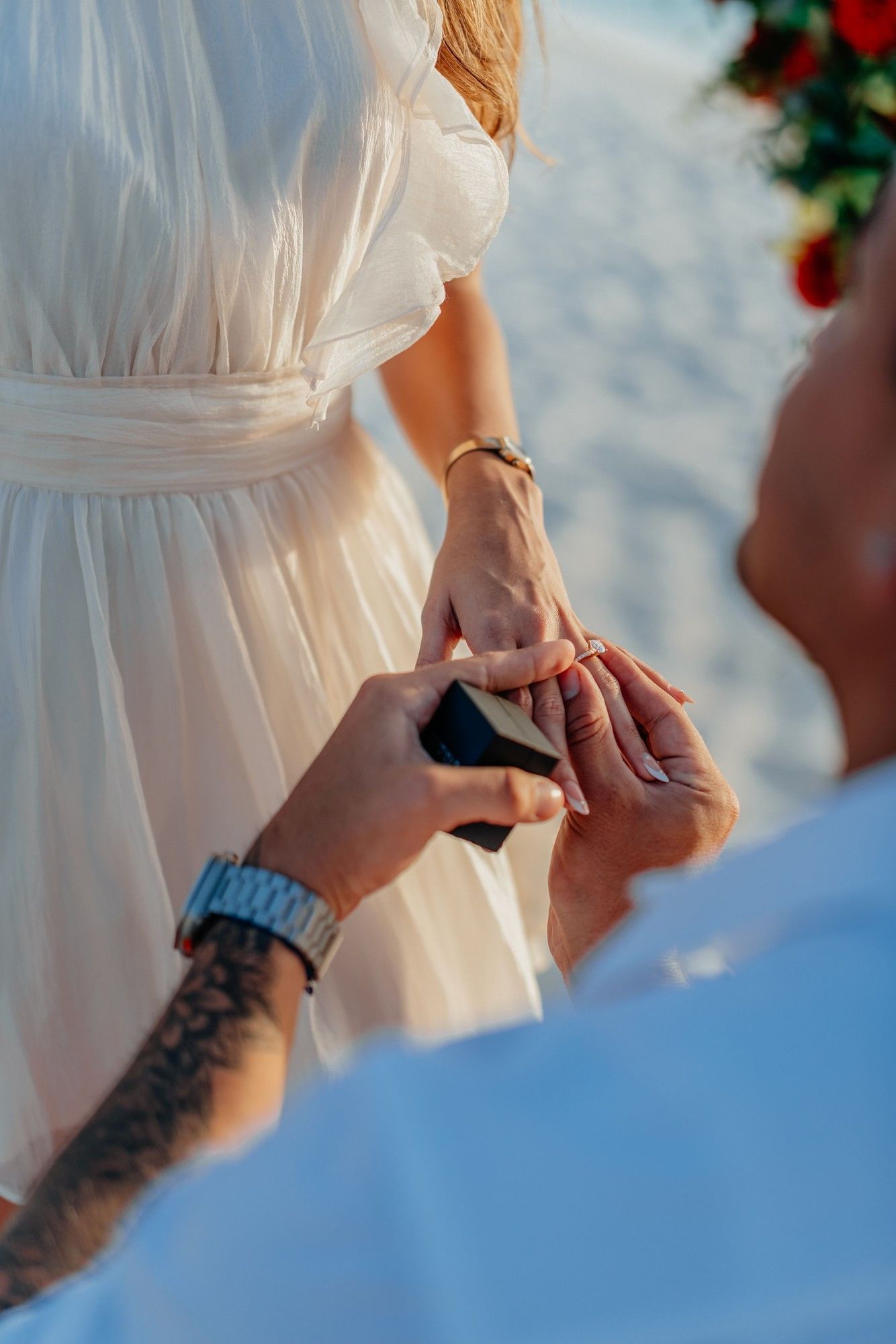 Wedding ring exchange beside the ocean